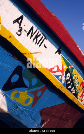 Colourful fishing boat on the shore at Plage des Pecheurs Fishermens Beach near Nouakchott on the south coast of Mauritania  Stock Photo