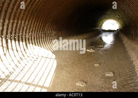 Drainage channels underneath the main road Stock Photo