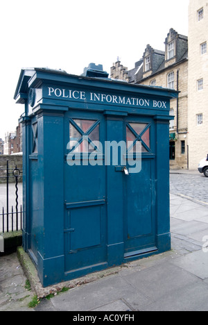 shopping on the grass market street in edinburgh with a blue police information box like the dr who tardis Stock Photo