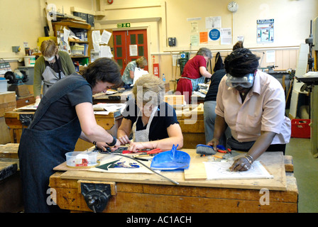 Adult education evening class in stain glass making. Stock Photo