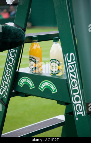 Bottles of Robinsons Barley water on an umpire's chair / seat   sponsored by Slazenger  at Wimbledon tennis Championship. UK Stock Photo