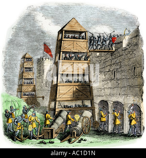Breaching tower archers and cannon used in a siege during the Hundred Years War. Hand-colored woodcut Stock Photo