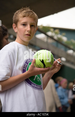 Autograph hunting boy at the Wimbledon tennis Championships UK Stock Photo