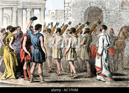 Consul and lictors bearing fasces in a procession in ancient Rome. Hand-colored woodcut Stock Photo