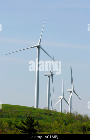 Wind turbine produces kinetic energy in wind into mechanical energy converting wind to electricity located in Pennsylvania PA Stock Photo