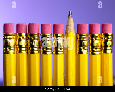 row of cheap pencil with rubbers on the end one turned around Stock Photo