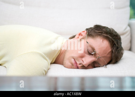 Man with spectacles sleeping peacefully Stock Photo