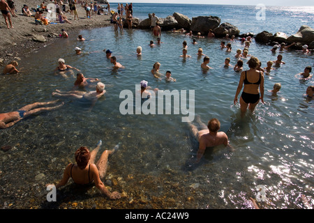 People bathing in the Embros Therme a naturally 40 degree hot spring added with sulfit knowing as health care near Kos Town Stock Photo