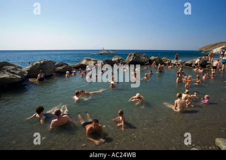 People bathing in the Embros Therme a naturally 40 degree hot spring added with sulfit knowing as health care near Kos Town Stock Photo