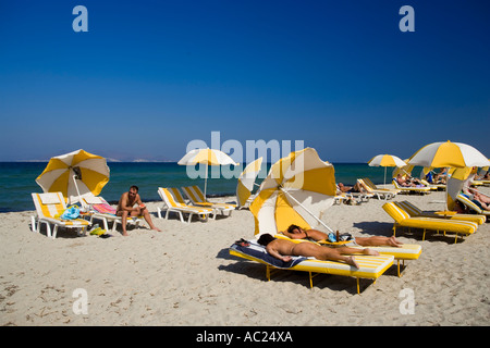 People sunbathing at beach Tigaki Kos Greece Stock Photo
