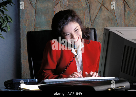 Woman working at her desk Stock Photo