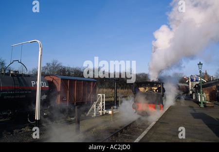 Rail enthusiasts running steam train at Museum at Chappel Wake s Colne station near Colchester Essex Stock Photo