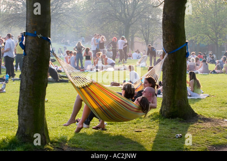 Group Swinging in Hammock Stock Photo