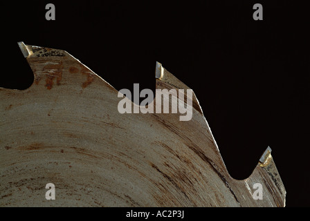 Circular Saw Blade Against a Black Background Stock Photo