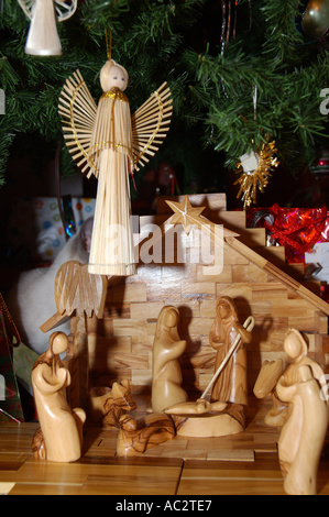 Creche nativity scene under the Christmas tree Stock Photo