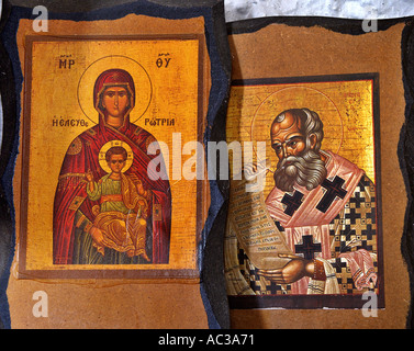 Madonna holding small child Jesus Saint Athanasios holding writings old church Crete Krete church Greece Stock Photo