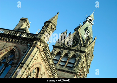 The Gothic design and spires of the Town Hall in the historic city of Chester in England against a blue sky Stock Photo
