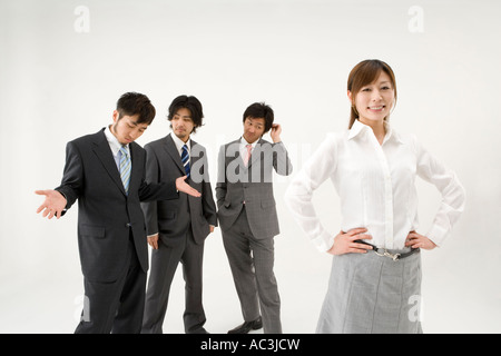 Businesswoman and three businessmen Stock Photo