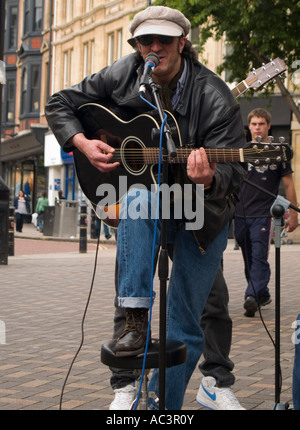 A Singer Plays His Guitar on St Peters Gate, at the City Pulse Music Festival in Nottinghamshire, May 2007 Stock Photo