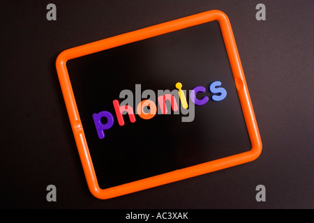 'Phonics' written with magnetic letters on children's blackboard Stock Photo