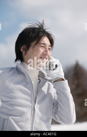 Young man using mobile phone Stock Photo
