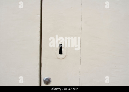 keyhole in white door, Puglia, Italy Stock Photo