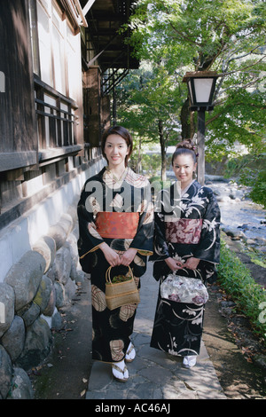 Two young women in kimono walking Stock Photo