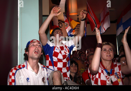 Croatian fans watching World Cup game vs Japan in London pub Stock Photo