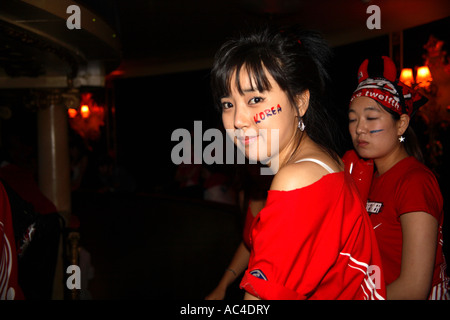 South Korean (Republic) fans watching 2006 World Cup Finals drawn match vs France, Cafe de Paris, London Stock Photo