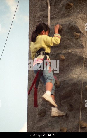 Asian girl rock climbing Stock Photo - Alamy