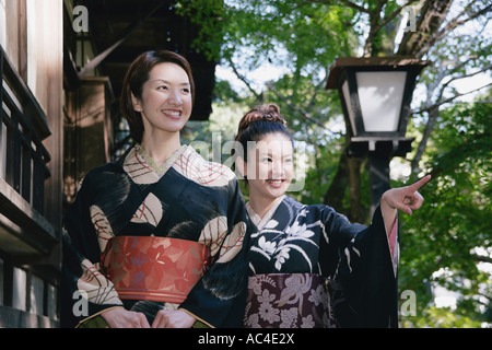 Two young women in kimono walking Stock Photo