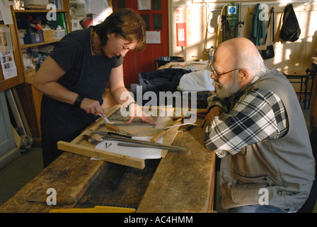 Teacher teaching adult education class in stain glass Stock Photo