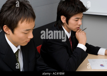 Young businessmen having meeting Stock Photo