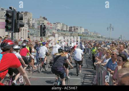 sponsored riders on Brighton promenade at finish of London to Brighton bike ride Stock Photo