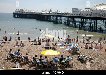 deckchairs and Brighton pier Stock Photo