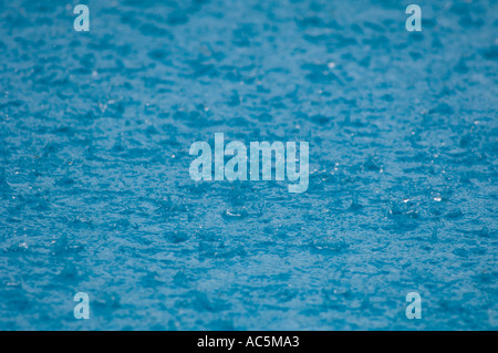 raindrops on pool Stock Photo