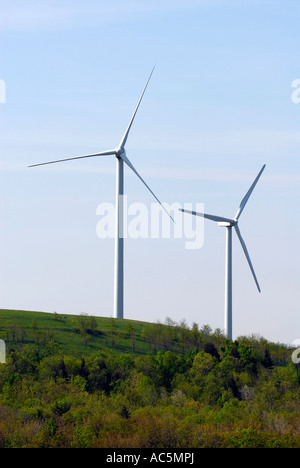 Wind turbine produces kinetic energy in wind into mechanical energy converting wind to electricity located in Pennsylvania PA Stock Photo