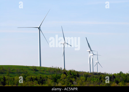 Wind turbine produces kinetic energy in wind into mechanical energy converting wind to electricity located in Pennsylvania PA Stock Photo