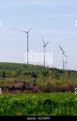 Wind turbine produces kinetic energy in wind into mechanical energy converting wind to electricity located in Pennsylvania PA Stock Photo