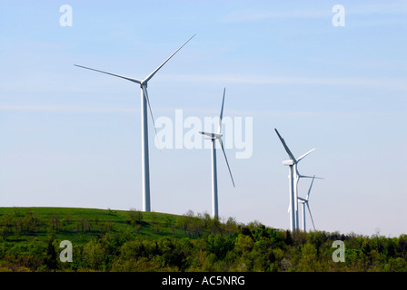 Wind turbine produces kinetic energy in wind into mechanical energy converting wind to electricity located in Pennsylvania PA Stock Photo