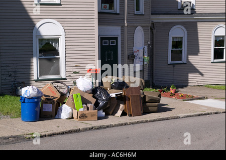 Trash from a house left on the curb for pickup in Oil City Pennsylvania Stock Photo