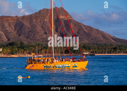 people, tourists, catamaran, boat, boats, boating, Waikiki Beach, Diamond Head, background,, Oahu, Oahu Island, Hawaii, United States Stock Photo