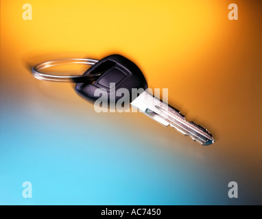 car key on key ring on yellow and blue backgroung Stock Photo
