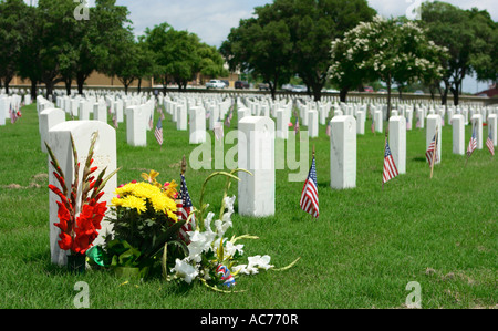 Decorated tombstones at Fort Sam Houston National Cemetary San Antonio Texas USA Stock Photo