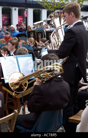 camborne town brass band performing outdoors in camborne town centre,cornwall,england Stock Photo