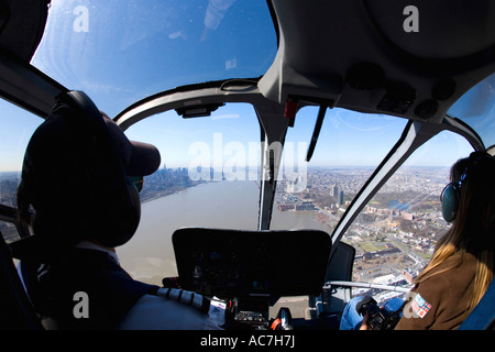 New York City Lower Manhattan downtown and Hudson River aerial photo from inside cockpit of helicopter New York City NY NYC Stock Photo