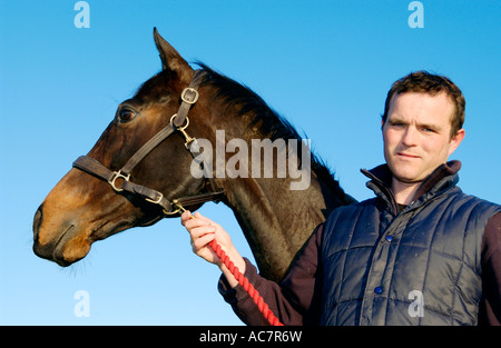 Evan Williams racehorse trainer with a horse he is training 'State of Play' at his Vale of Glamorgan yard South Wales UK Stock Photo