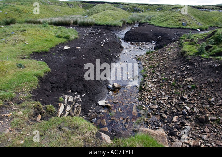 Exposed peaty black soil Chapel Fell St Johns Chapel Yorkshire Northumberland border UK Stock Photo