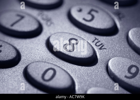 A close up of a keypad on a modern telephone. Selective focus on the number eight. Stock Photo