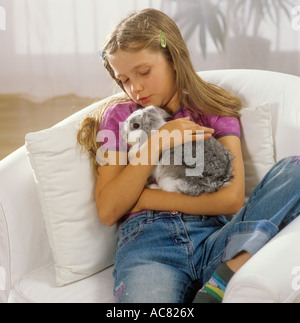 girl with lop-eared dwarf rabbit Stock Photo